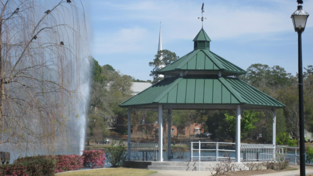 Photo of a green and white gazebo overlooking Lake Ella.