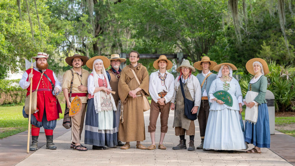 An image of 10 Mission San Luis employees dressed up as Spaniards from the 18th century.