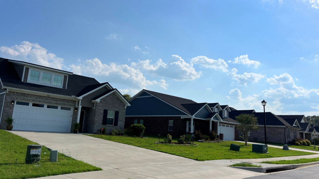 Row of homes on a blue sky day in the Summerfield neighborhood in Tallahassee, FL